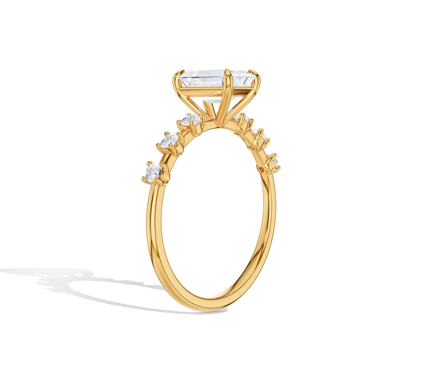 emerald cut diamond with side stone