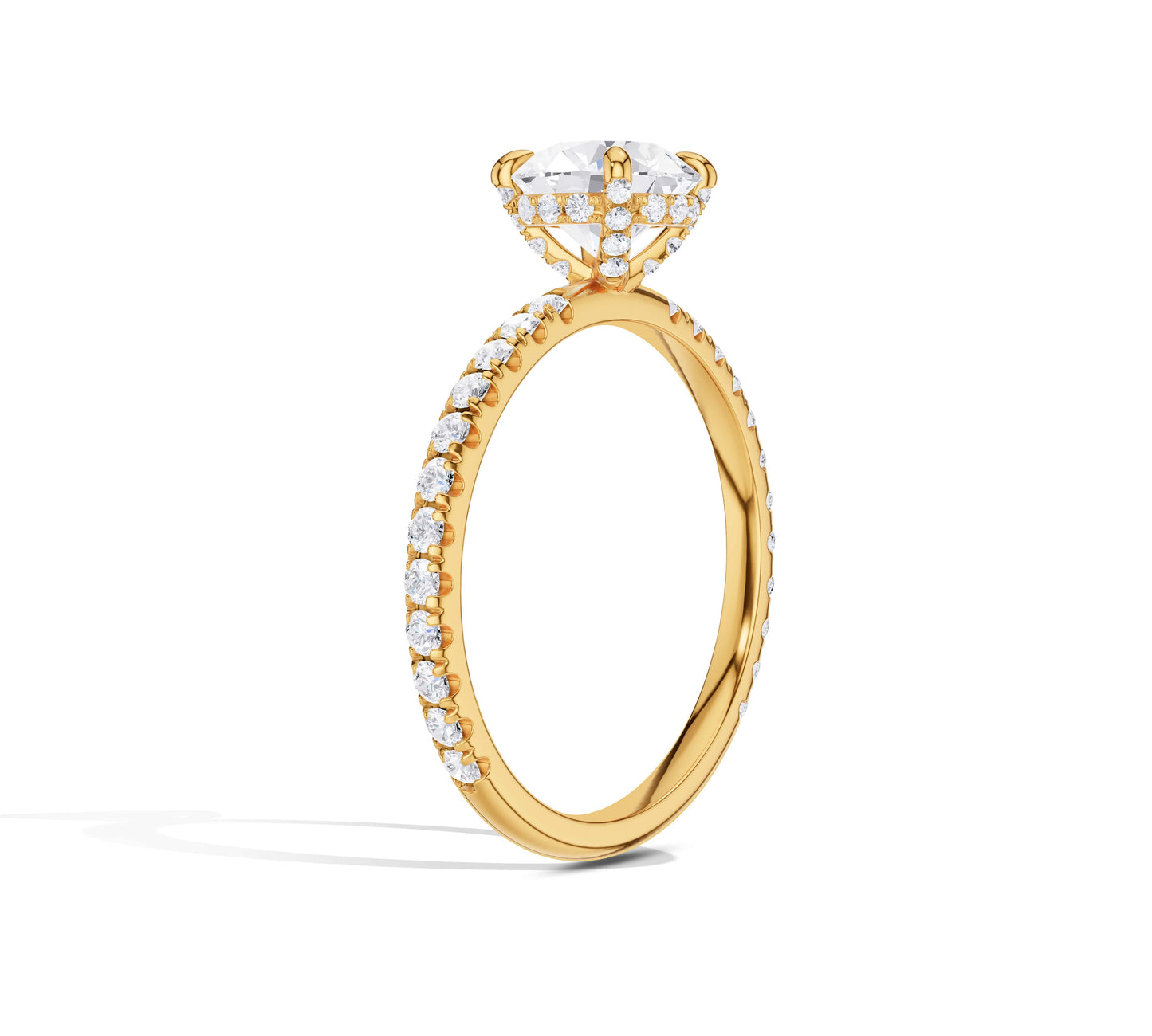 Classic round diamond set on a slim pavé yellow gold band