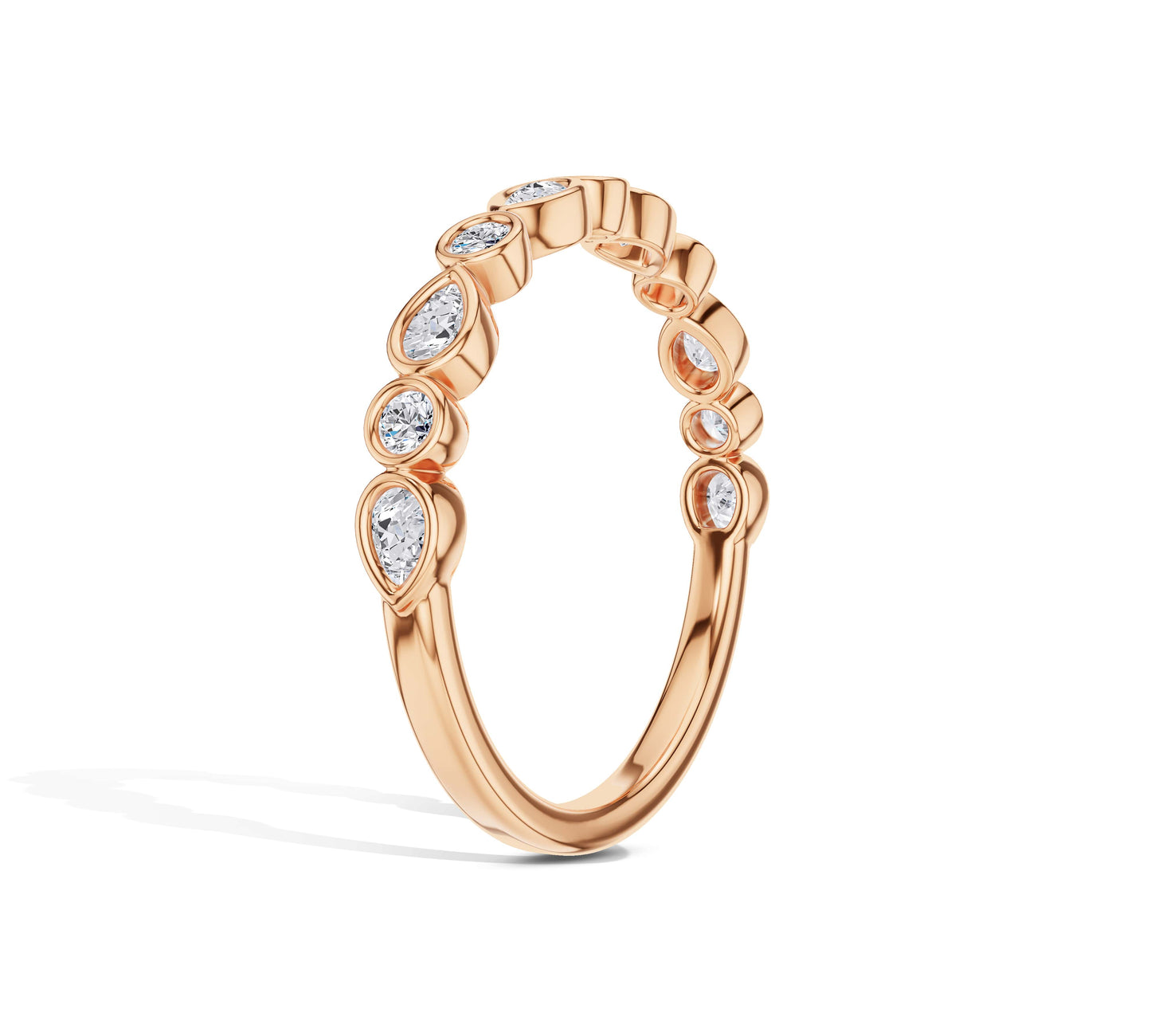 Pear and round bezel set diamond ring in 18K rose gold