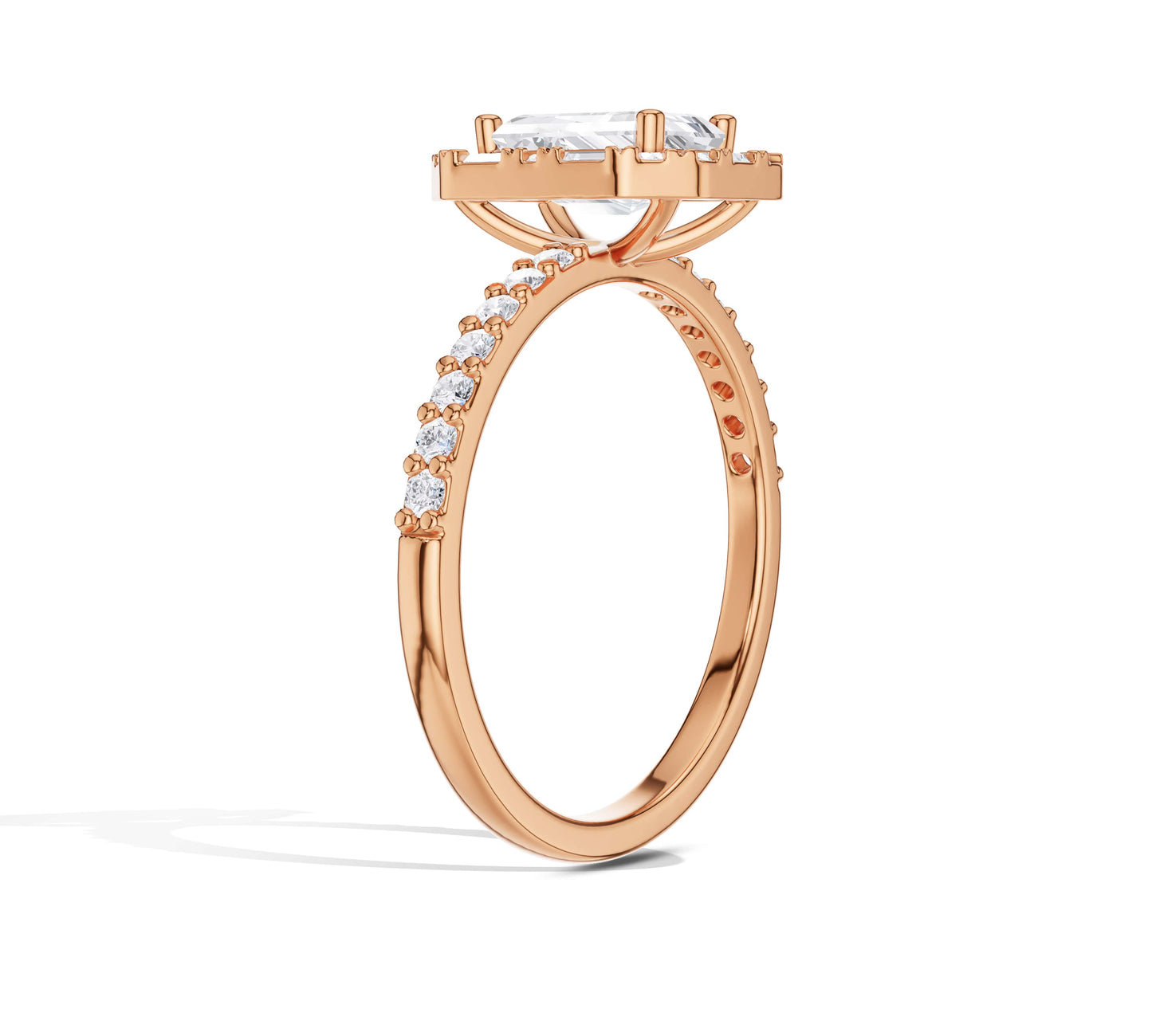 Radiant halo ring with emerald-cut center in yellow gold