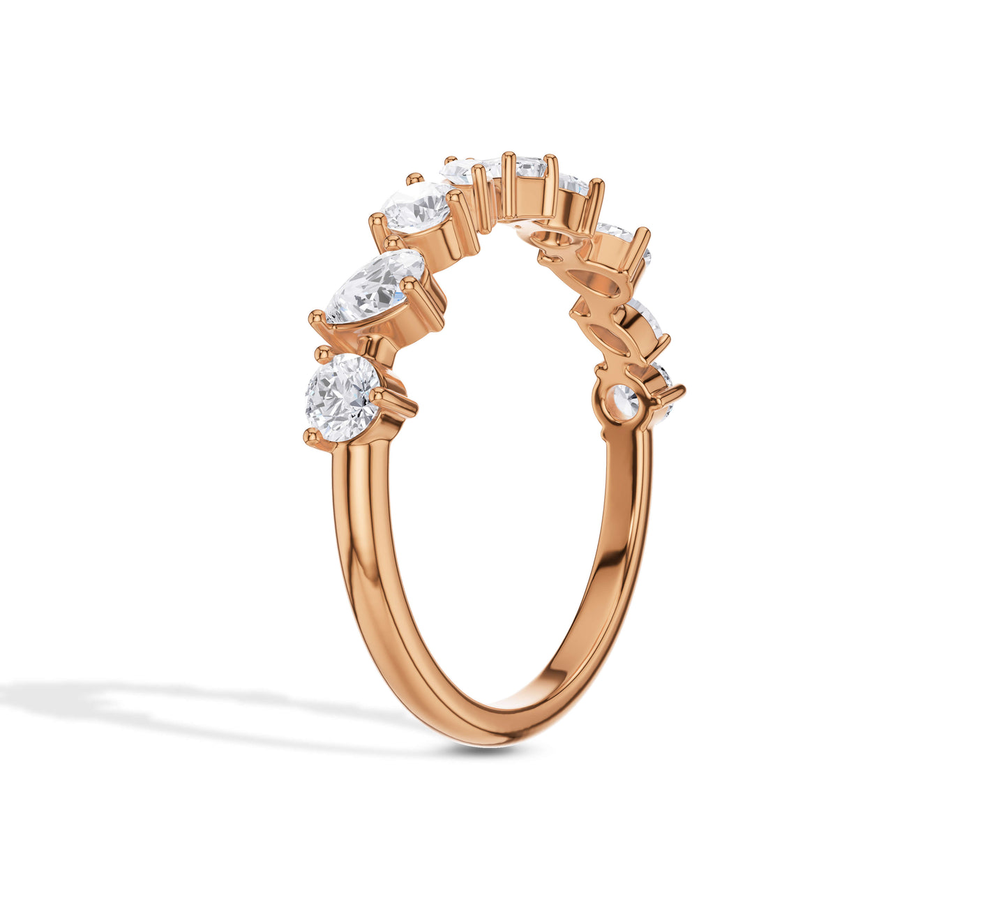 Artistic diamond ring with marquise, round, and emerald cuts in rose gold