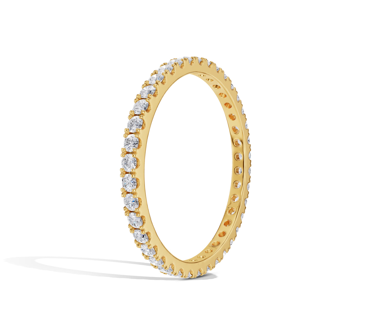 Close-up of thin gold diamond band
