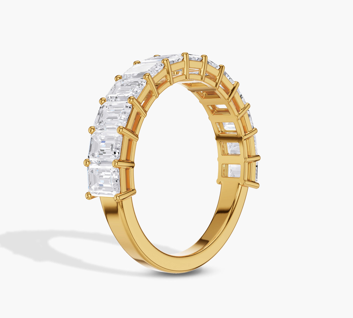 Sleek yellow gold emerald diamond ring