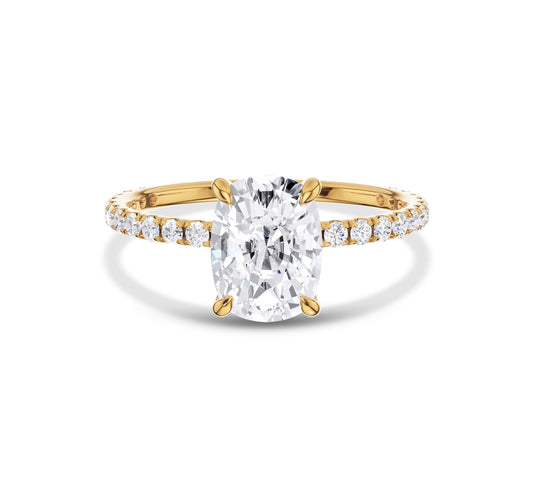 Yellow gold cushion cut moissanite engagement ring with pavé diamonds
