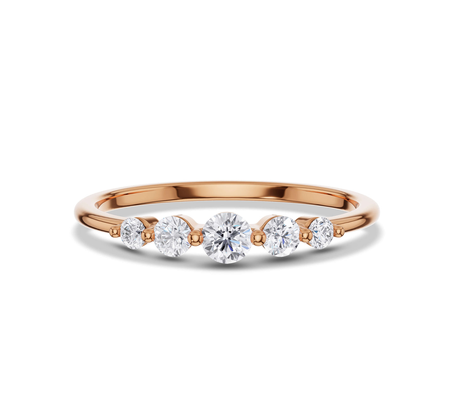 Delicate yellow gold ring featuring lab grown diamonds in a five-stone setting