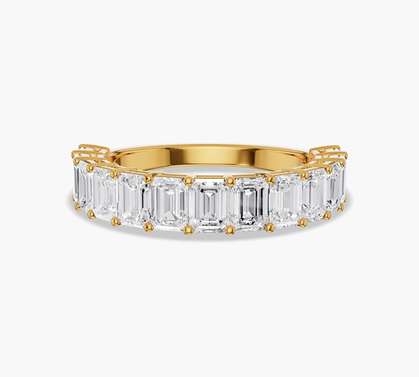 Half eternity band with emerald cut diamonds