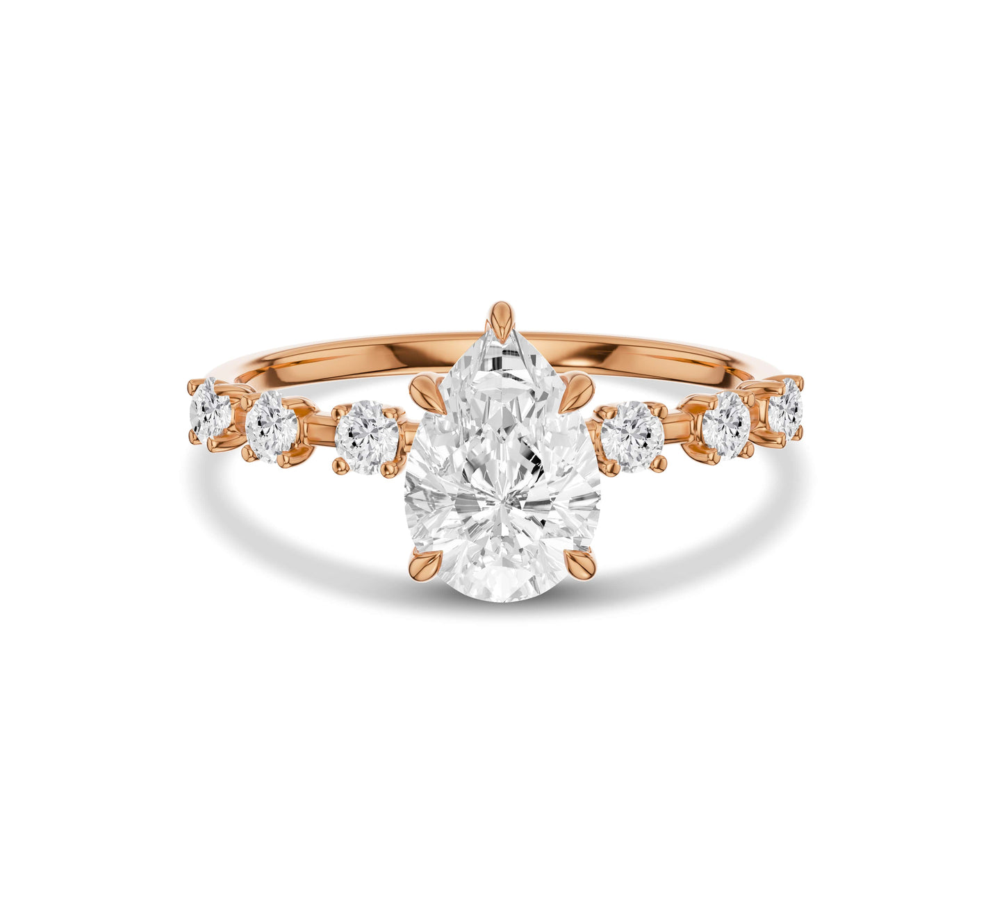 Rose gold pear shape engagement ring with side diamonds