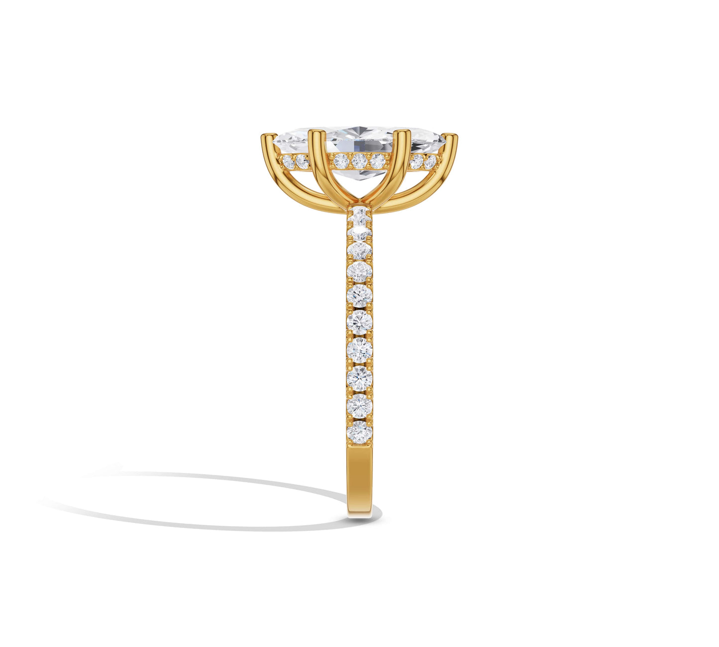 marquise cut engagement ring in yellow gold halo design