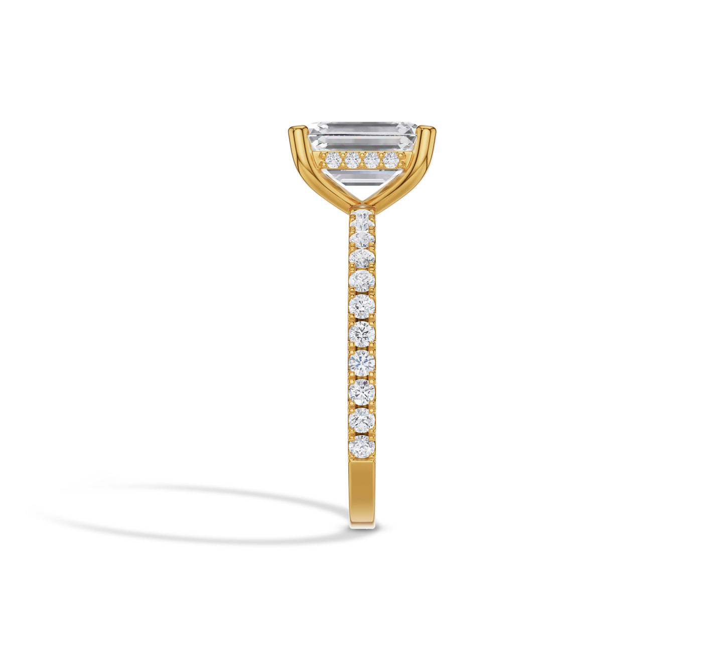 Yellow gold ring with emerald center diamond