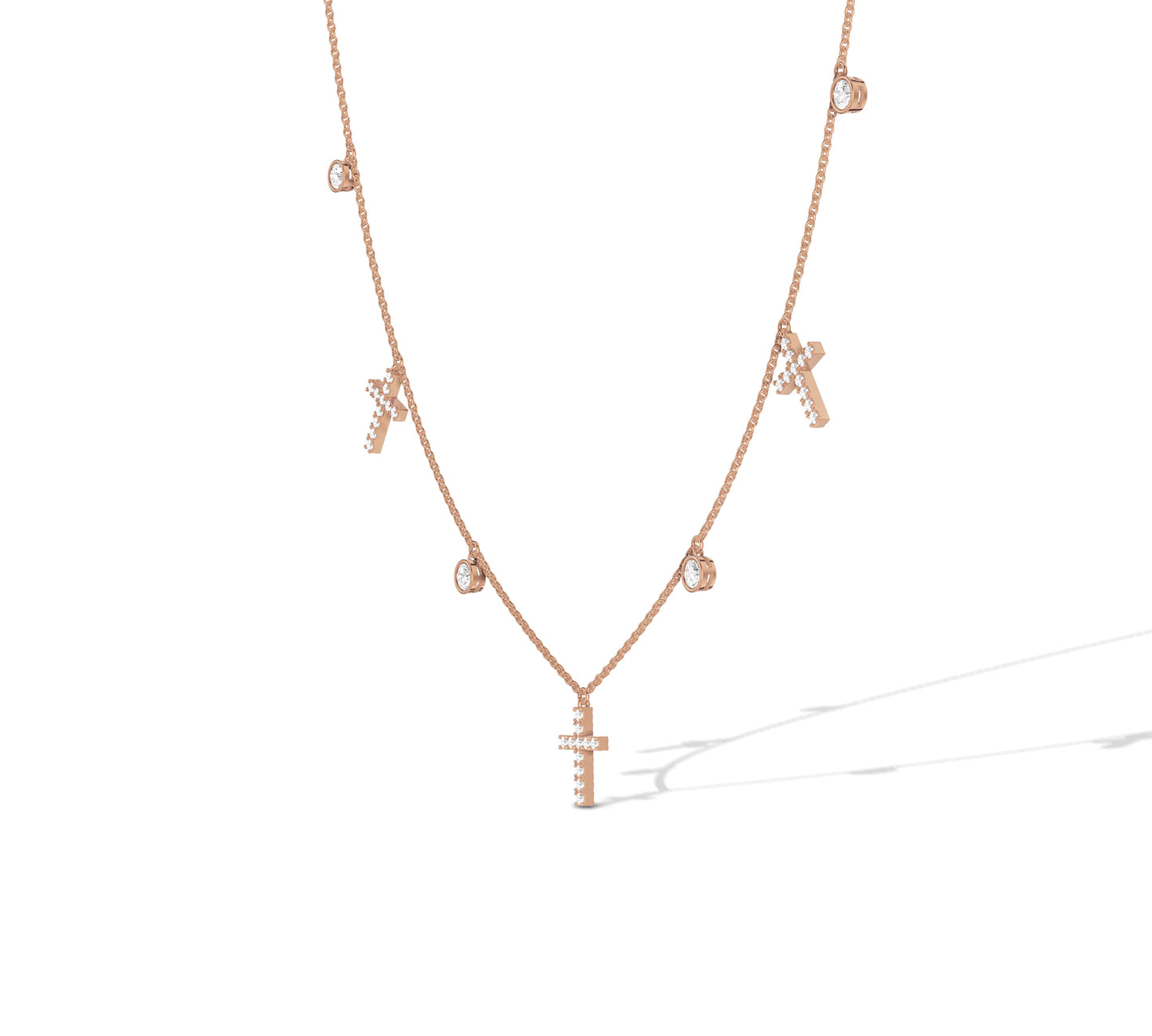 Delicate rose gold chain with cross and bezel details