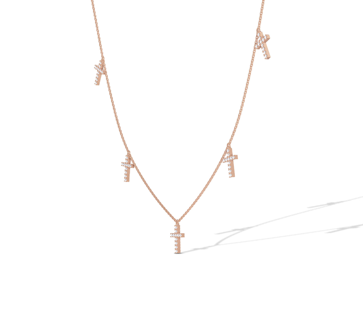 Stylish rose gold necklace with multiple diamond crosses