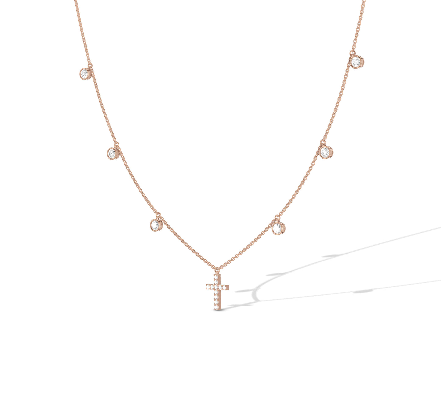 Elegant rose gold charm necklace with cross centerpiece