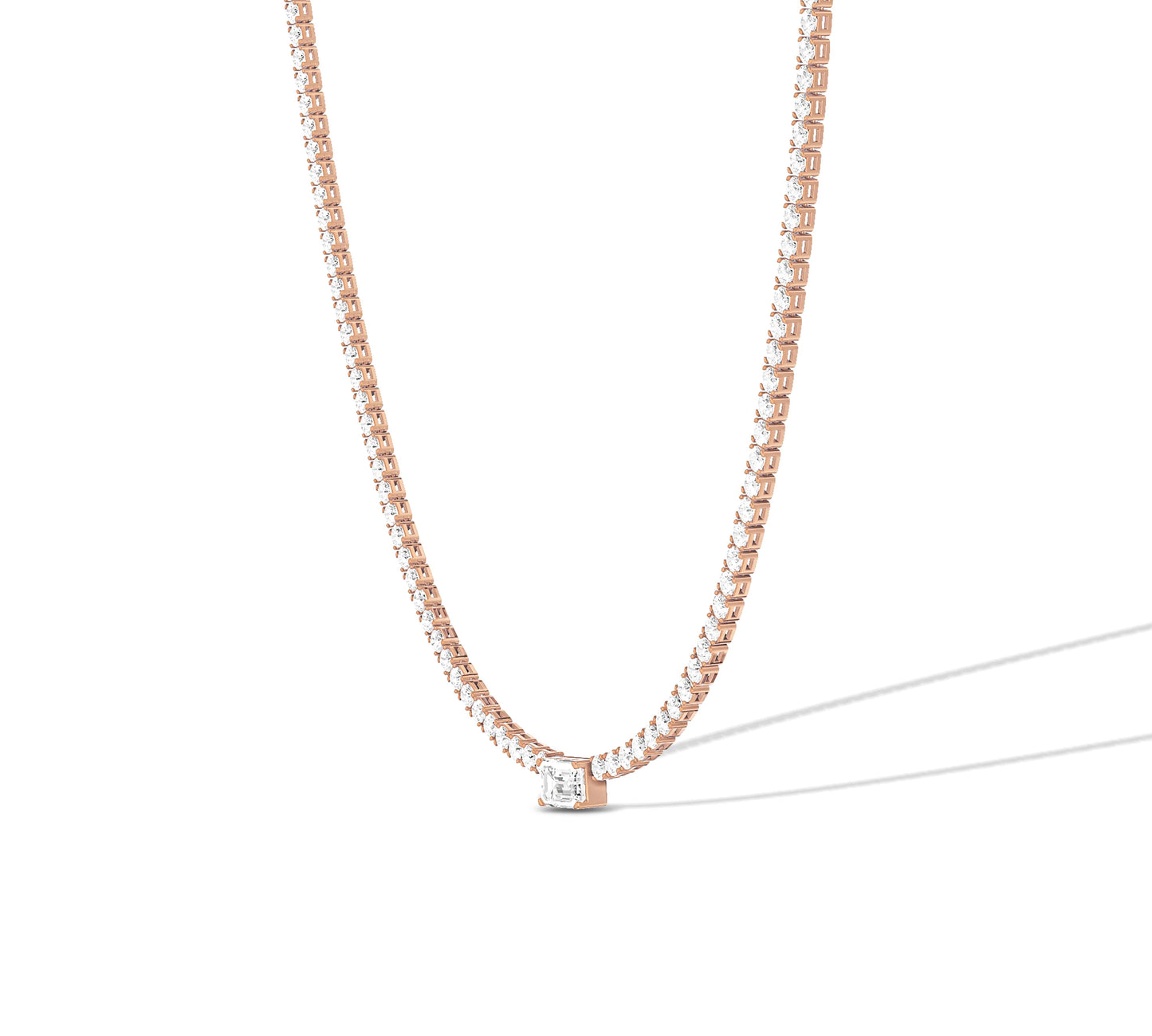 Elegant gold tennis necklace with emerald cut