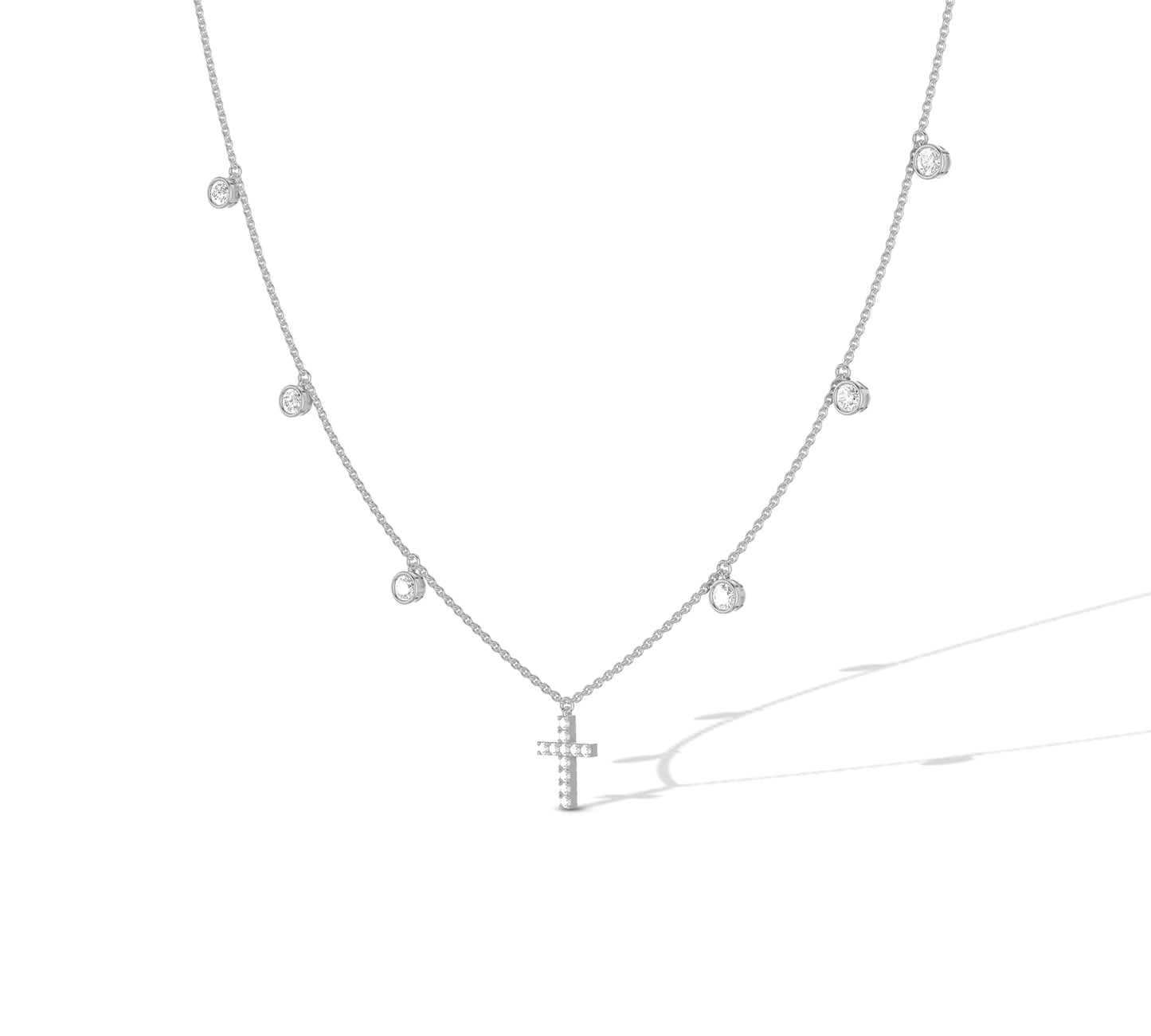 Minimalist white gold necklace with a cross and diamonds