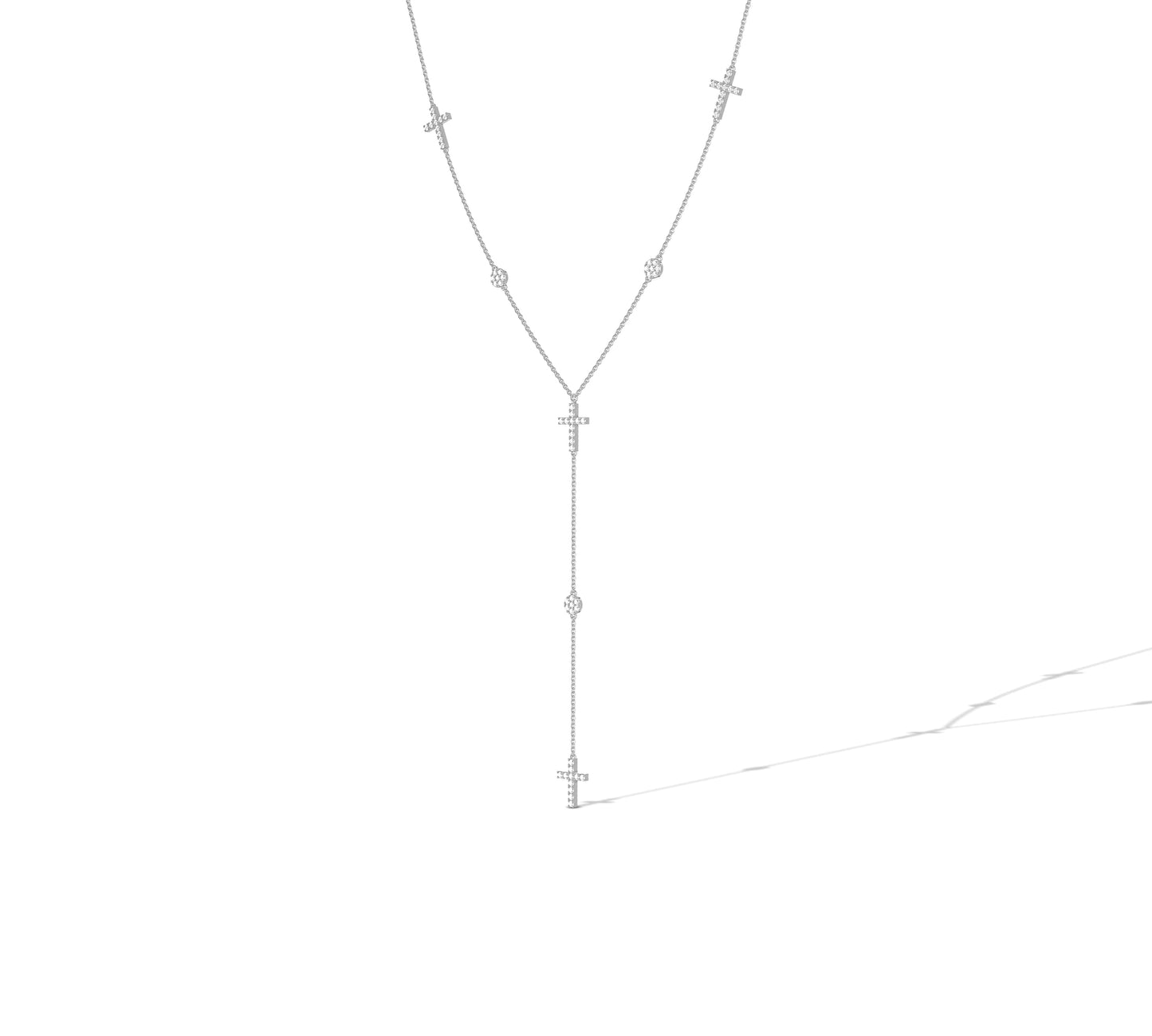 Elegant white gold lariat with cross and diamond details