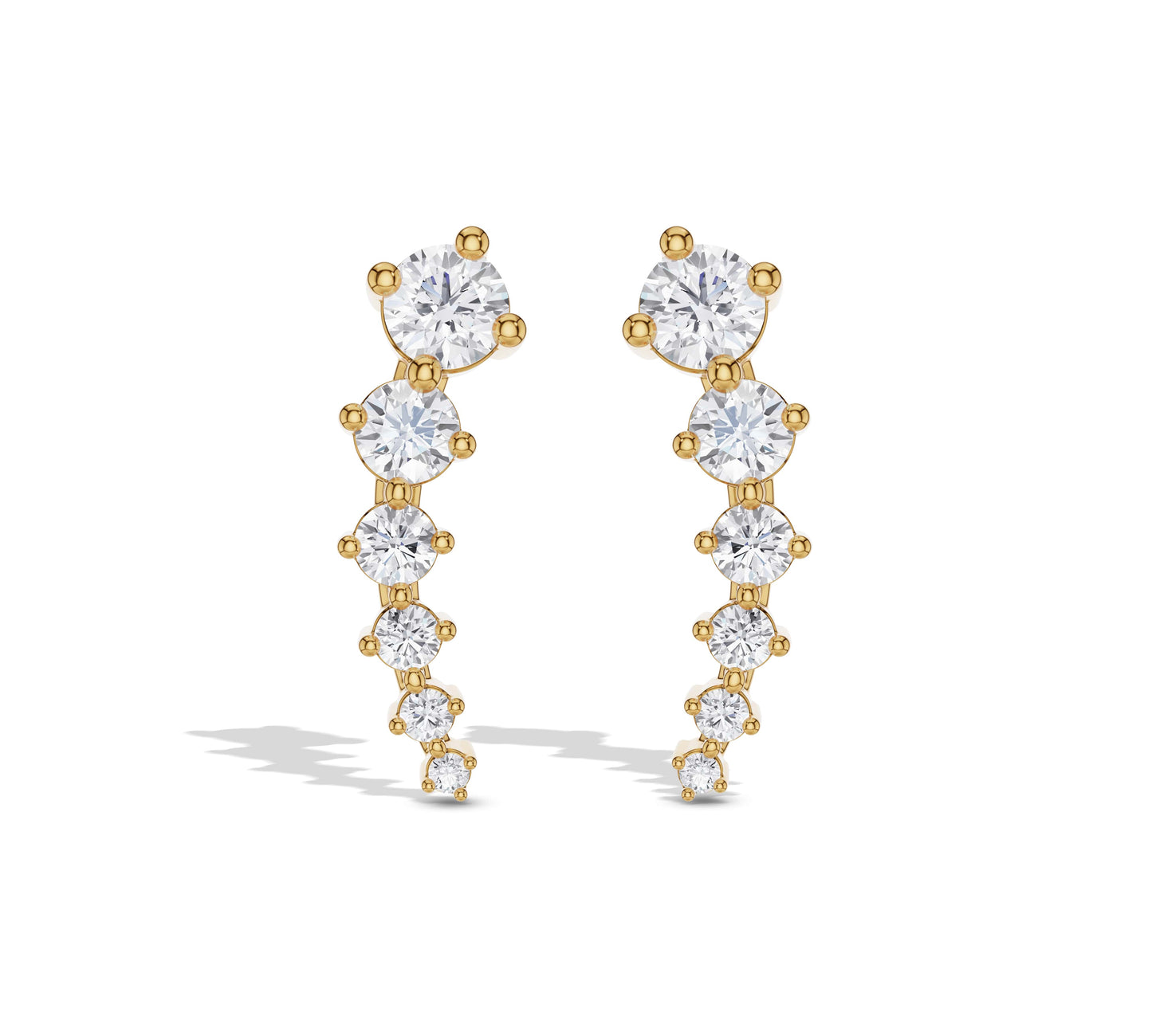 Long graduated diamond earrings in yellow gold