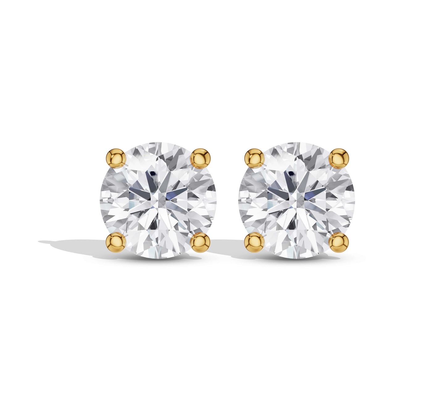 Round cut diamond studs yellow gold