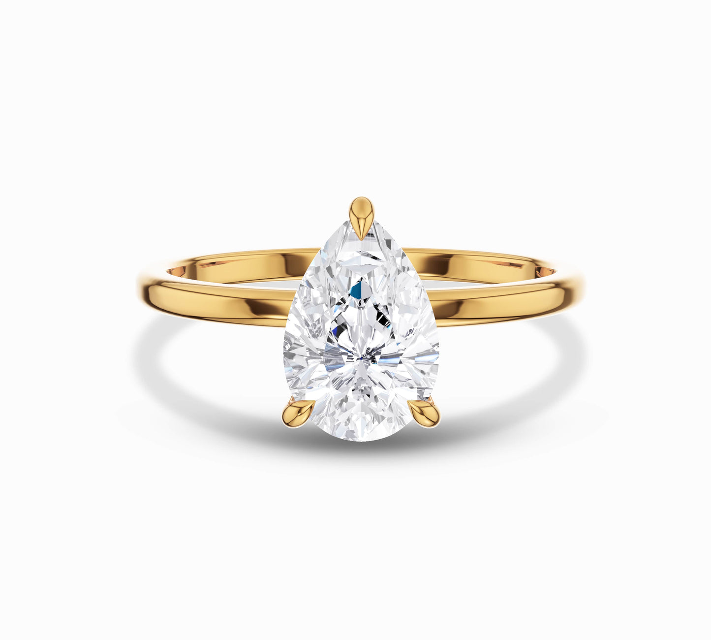 Pear cut solitaire diamond ring in yellow gold