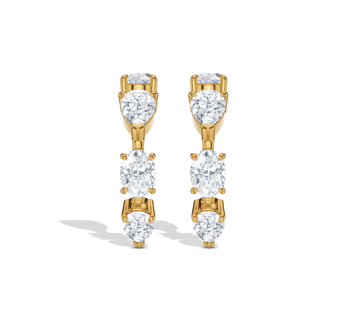 Curved crawler earrings with oval and round diamonds