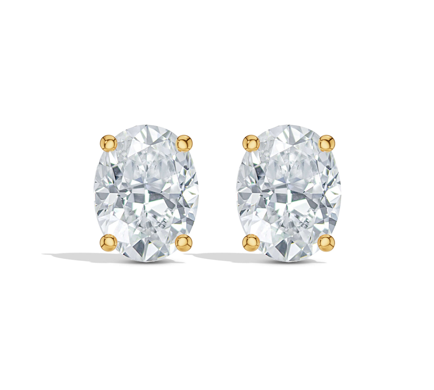 Oval diamond studs with four-prong gold setting