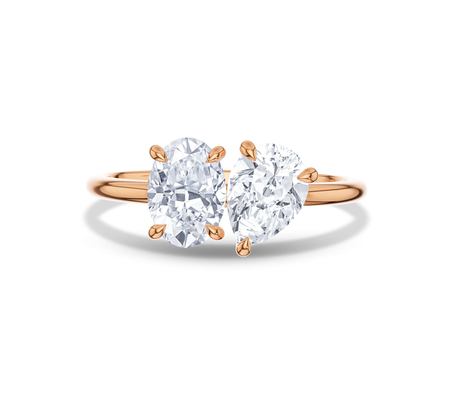 Rose gold Toi et Moi ring featuring oval and pear moissanite stones