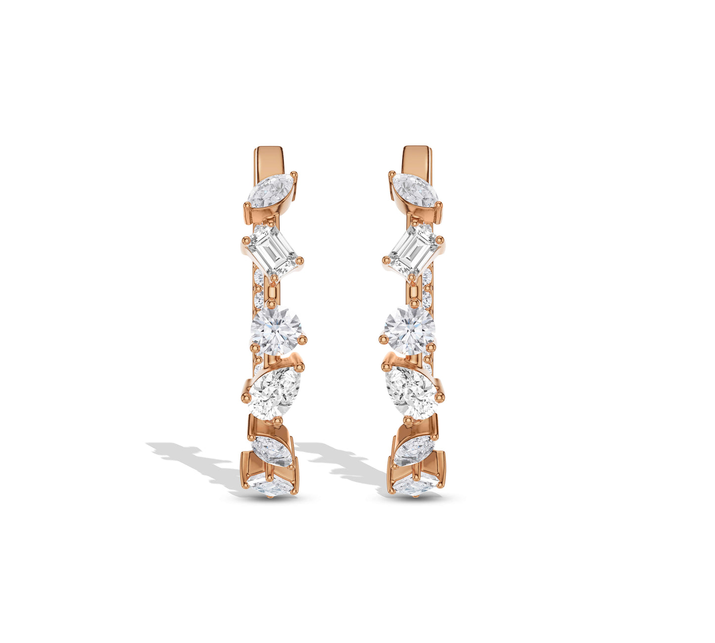 Gold hoops featuring marquise, baguette, and round diamonds