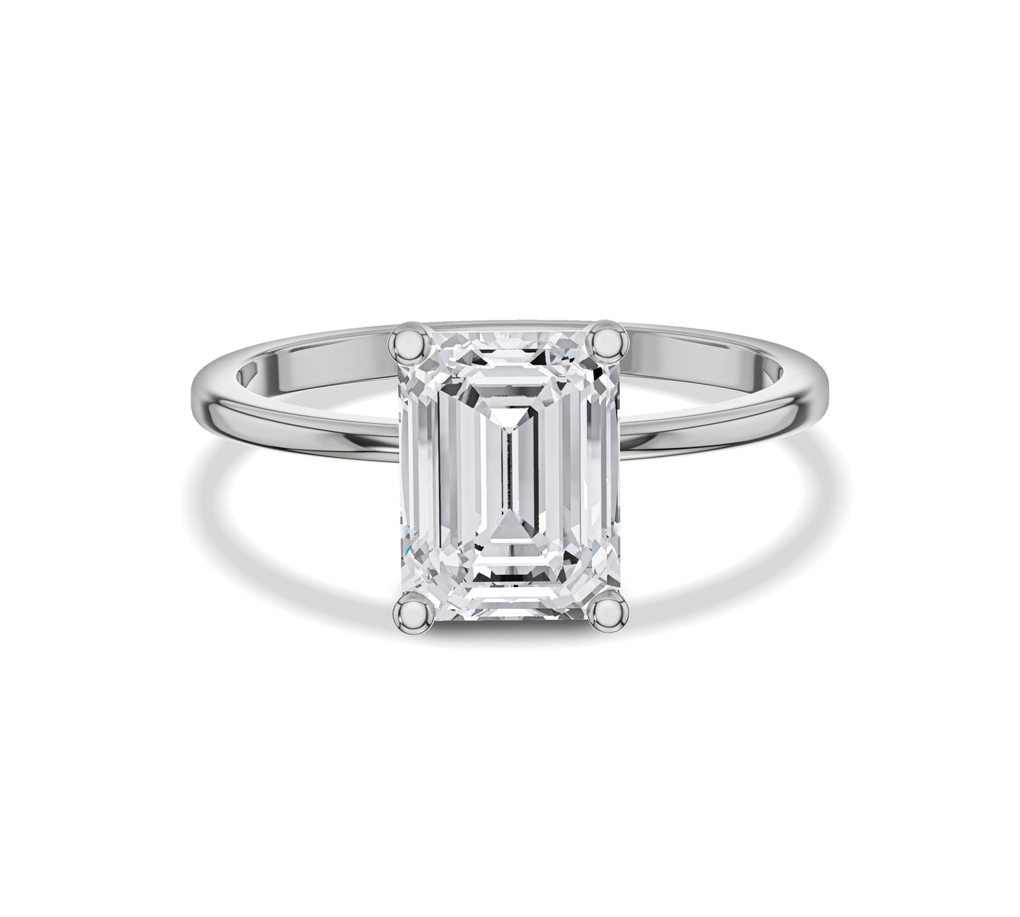 engagement ring with emerald solitaire