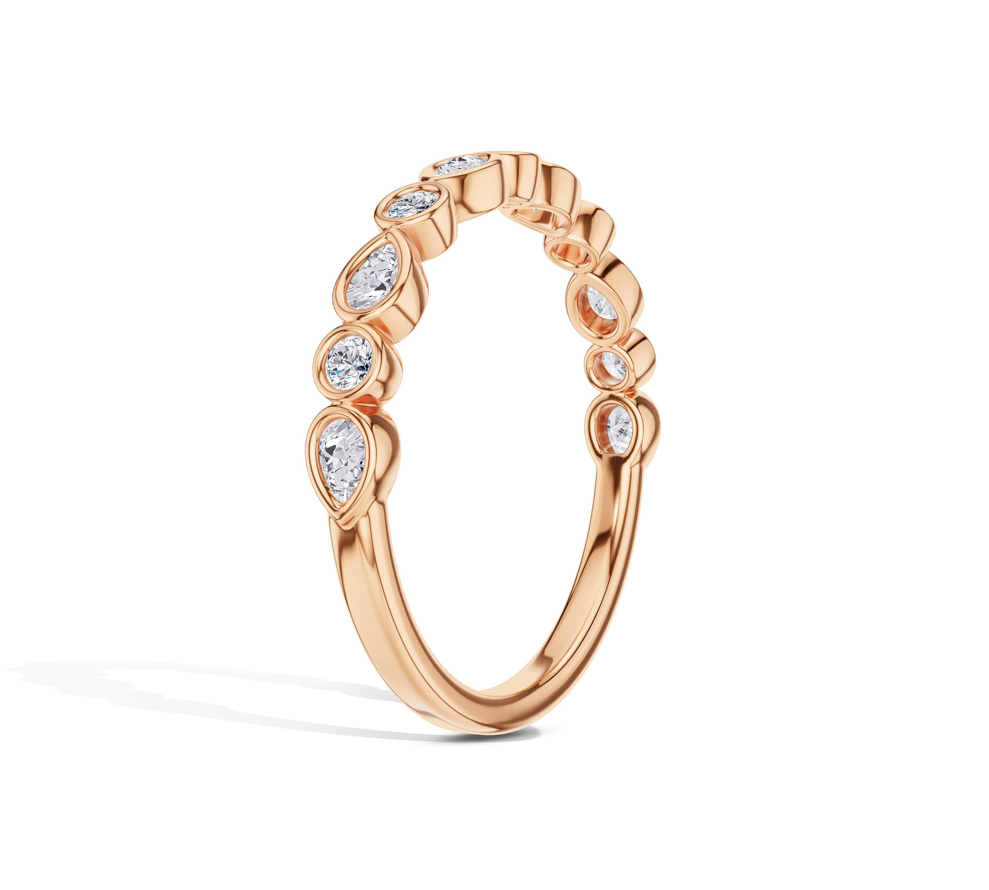 Pear and round bezel set diamond ring in 18K rose gold