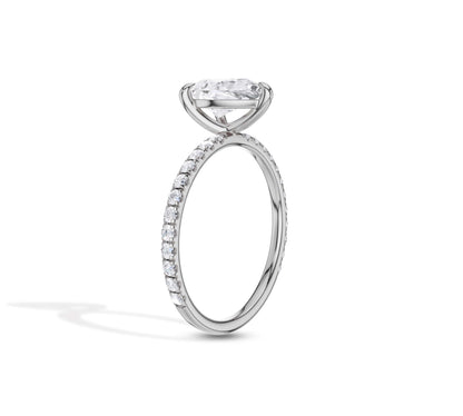 Stylish white gold ring with pavé band and pear center