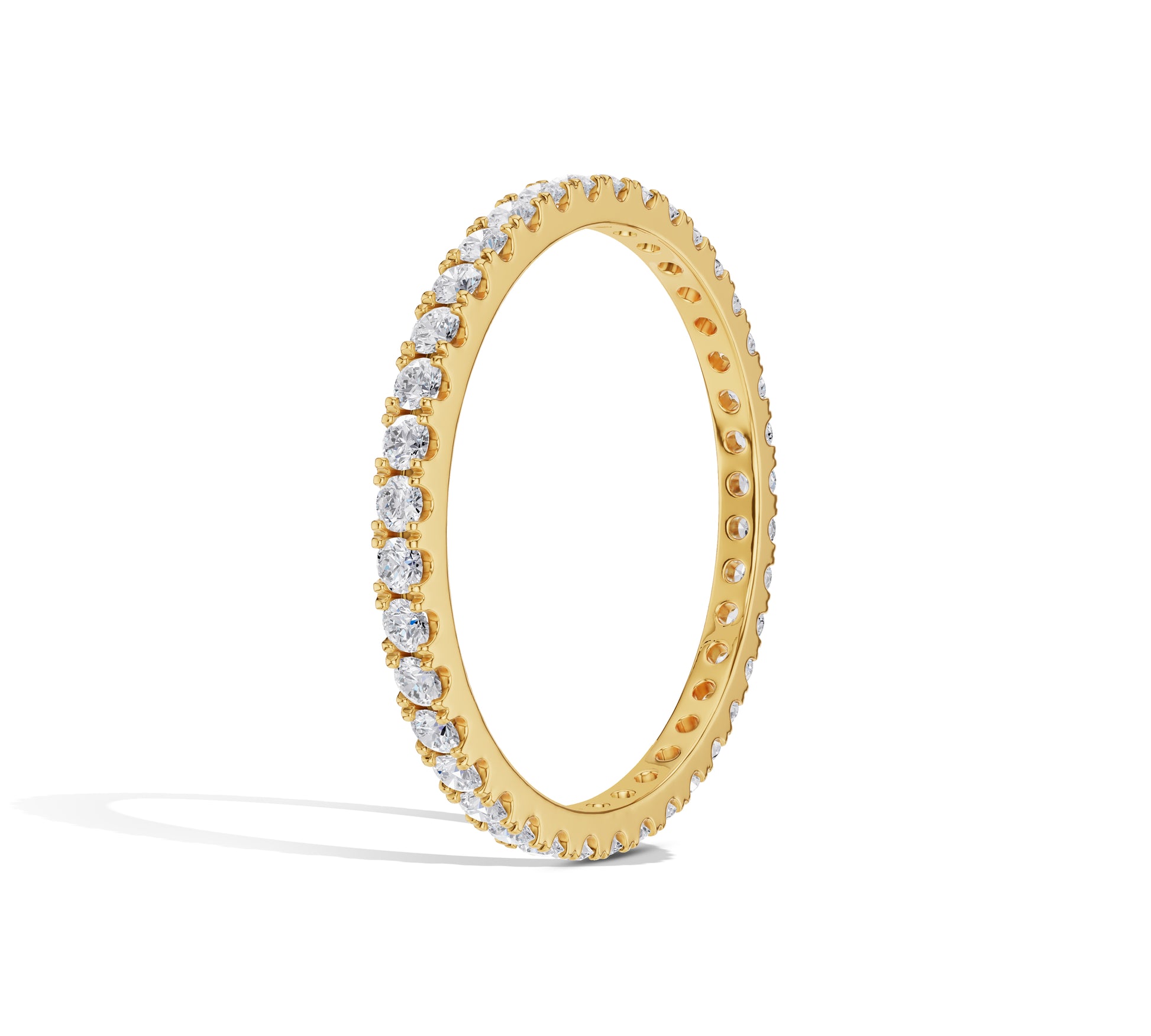 Close-up of thin gold diamond band