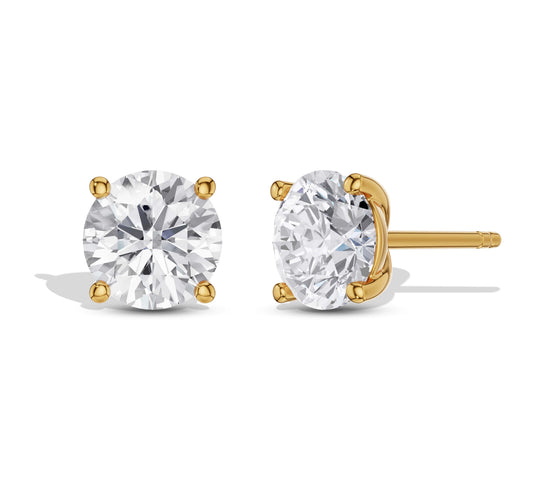 Minimalist solitaire diamond studs on white background