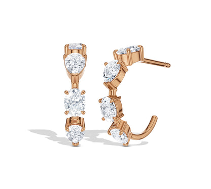 Moissanite and gold earrings in an elegant curve