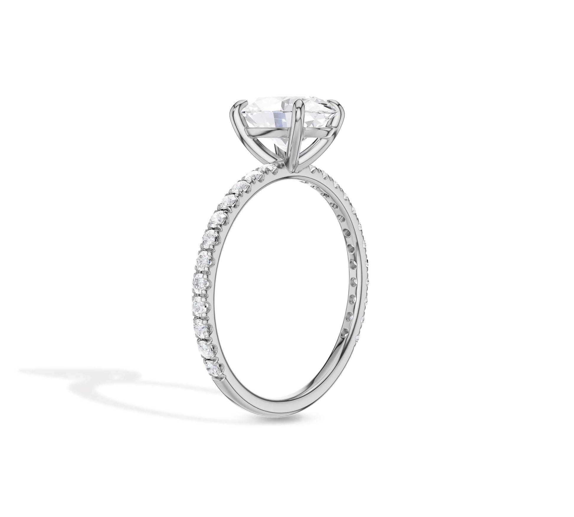 Oval diamond solitaire ring with pave shank design