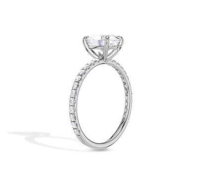 Oval diamond solitaire ring with pave shank design