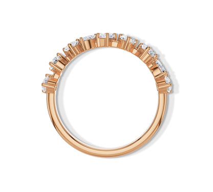 Rose gold band with assorted moissanite shapes in a unique staggered setting