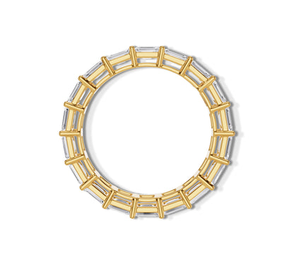 Gold ring with symmetrical emerald cuts