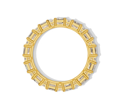 Elegant gold band with continuous emerald-cut diamonds surrounded by round accents