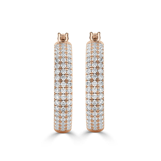 Exquisite gold hoop earrings adorned with sparkling diamonds