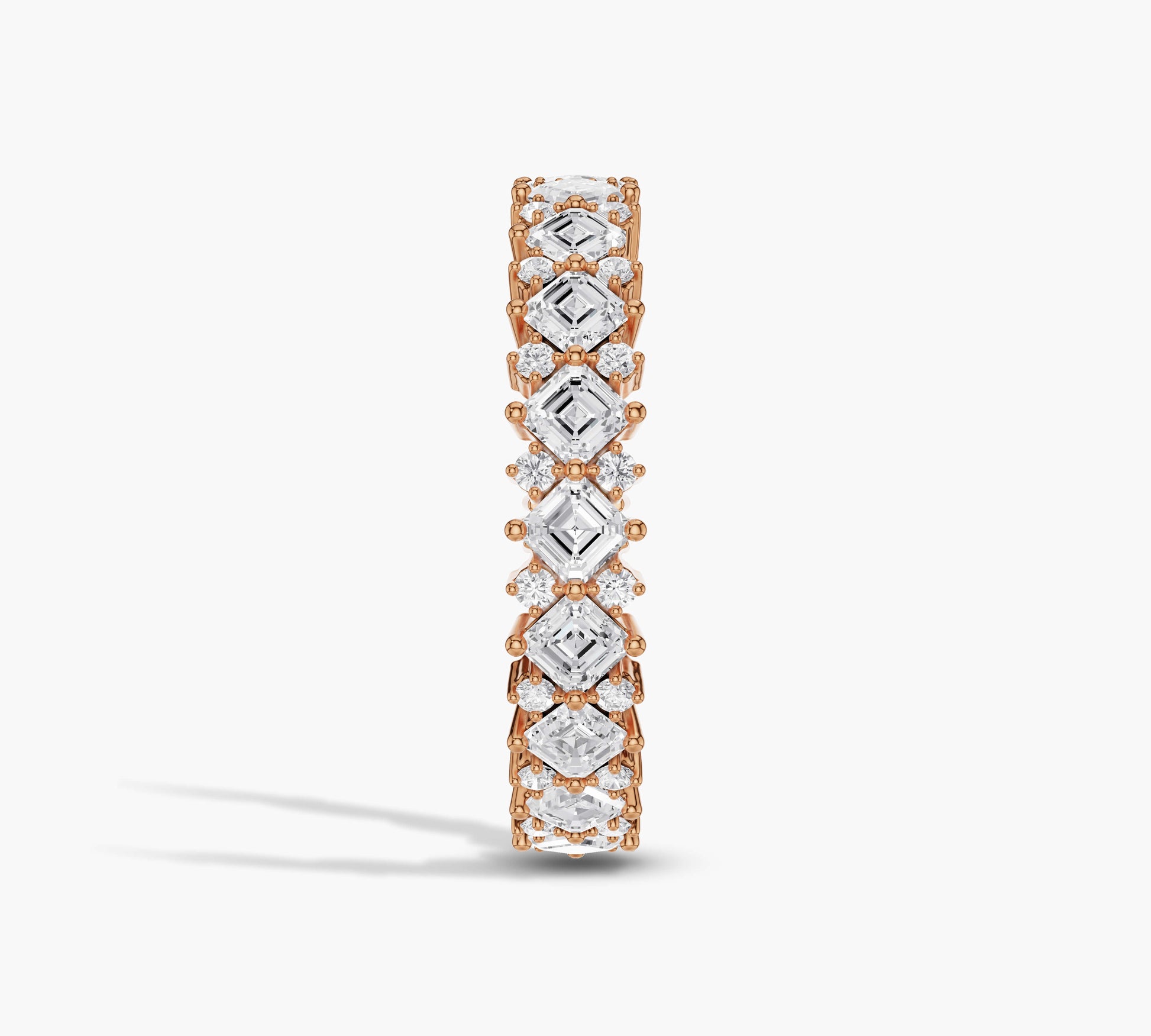 Alternating diamond shapes in full eternity ring