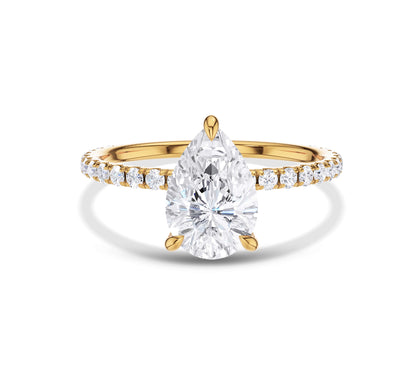 Pear-shaped diamond ring with pavé band in yellow gold