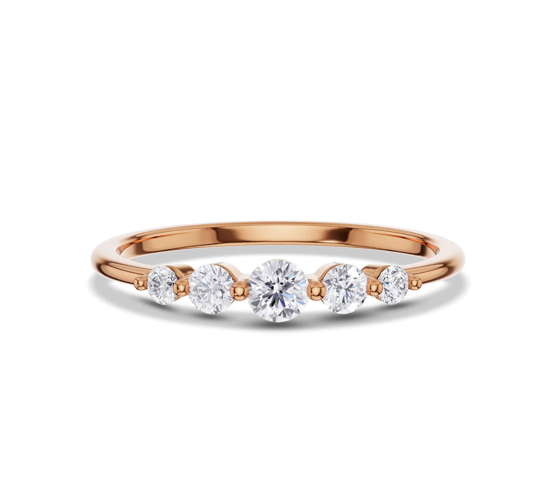 Delicate yellow gold ring featuring lab grown diamonds in a five-stone setting