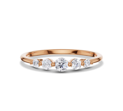 Delicate yellow gold ring featuring lab grown diamonds in a five-stone setting