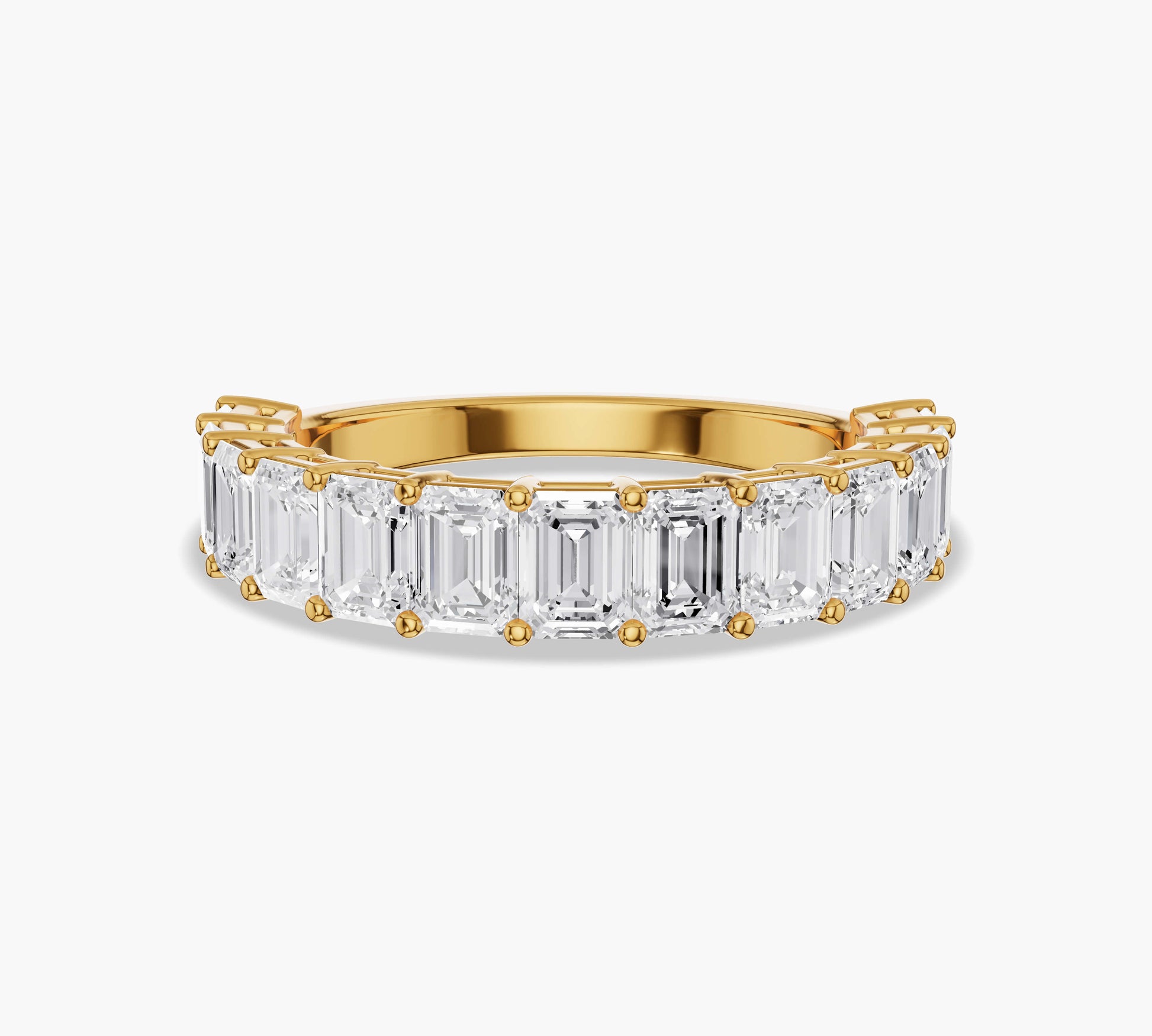 Half eternity band with emerald cut diamonds