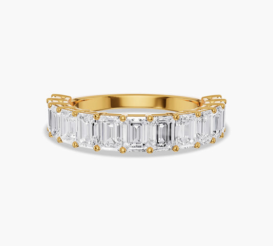 Half eternity band with emerald cut diamonds