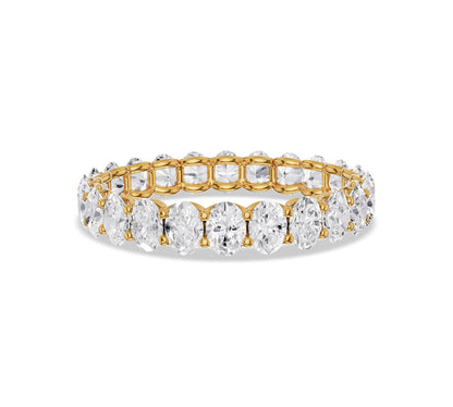 Oval cut diamond eternity ring in yellow gold