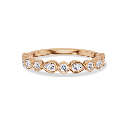 Rose gold eternity band with bezel pear and round diamonds