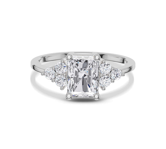 White gold radiant cut ring with diamond clusters