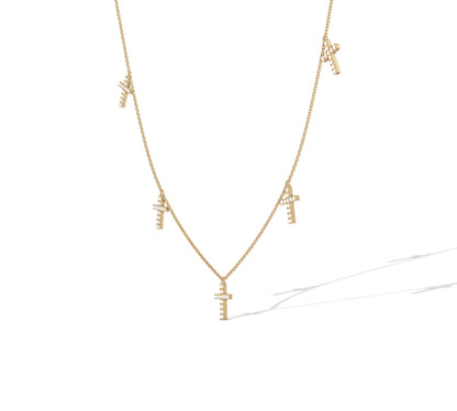 14K yellow gold station necklace with multiple cross pendants