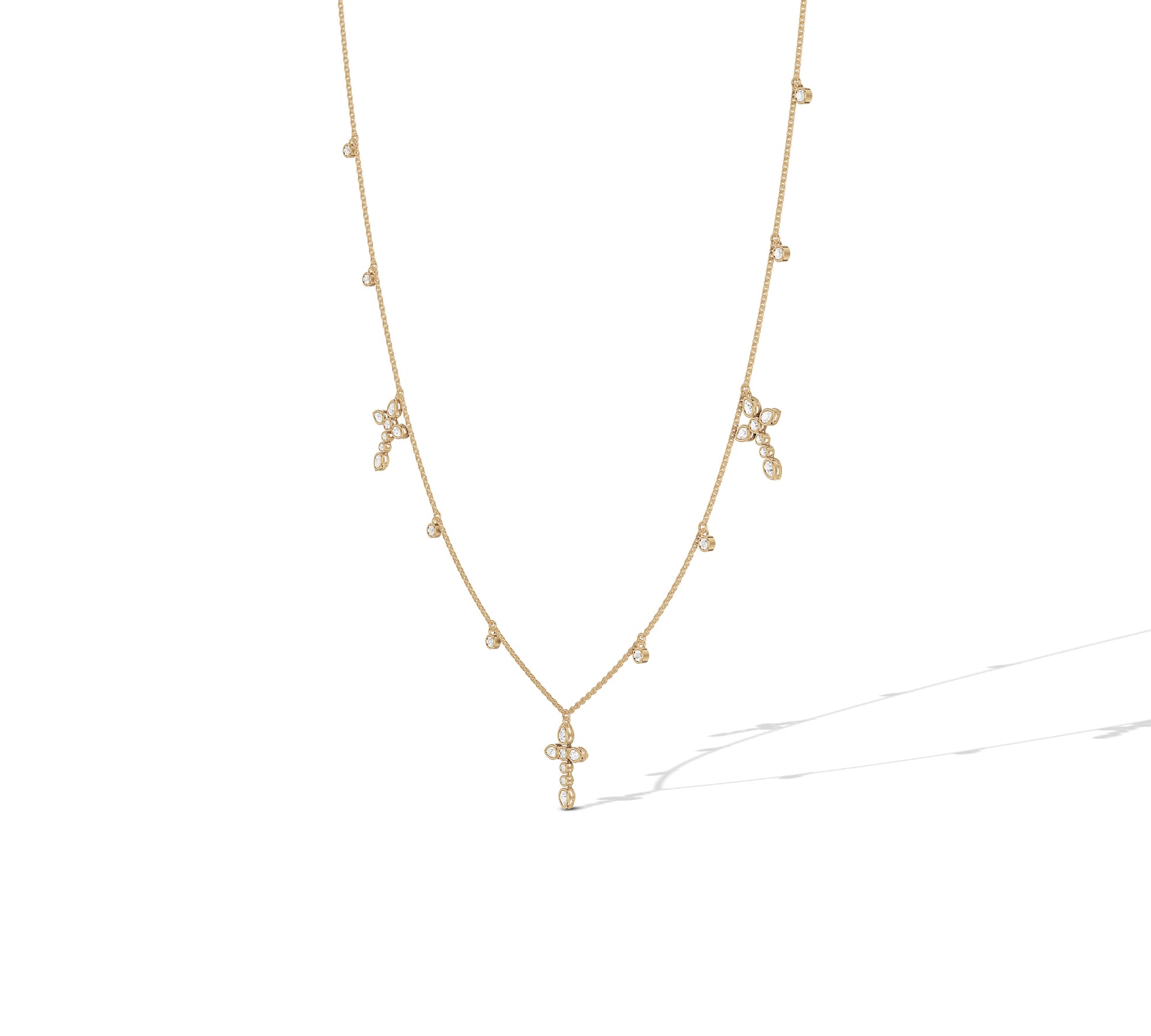 14K yellow gold cross necklace with pear and round diamonds