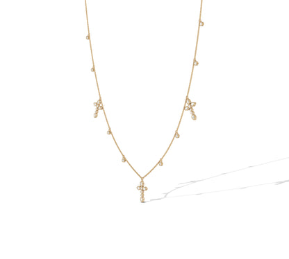 14K yellow gold cross necklace with pear and round diamonds